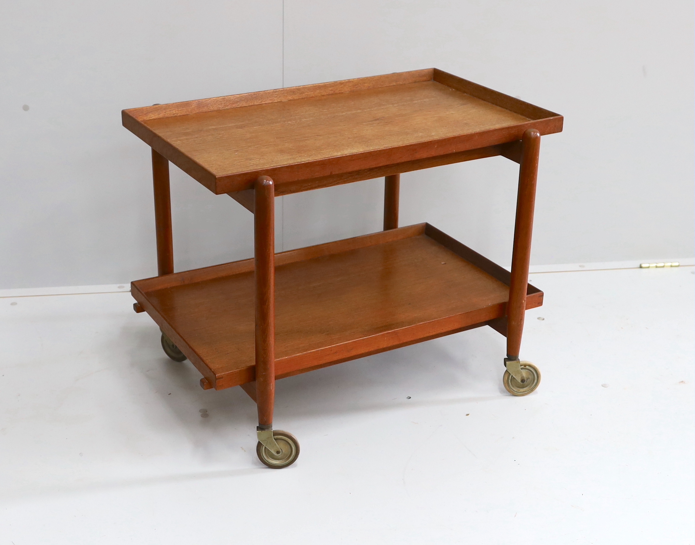 In the manner of Poul Hundevad, a mid century teak two tier tea trolley, width 75cm, depth 50cm, height 59cm